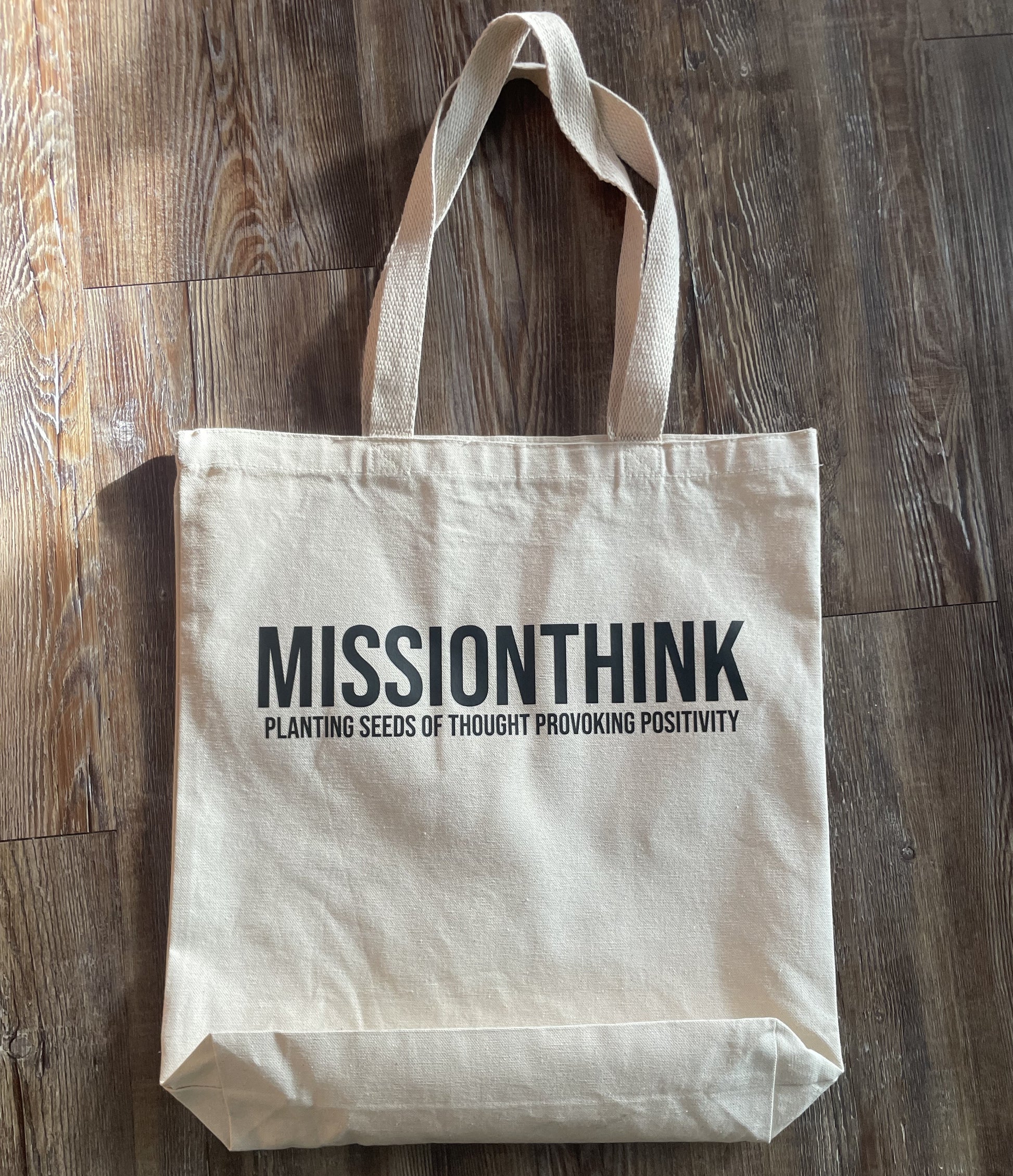 Mission Think Tote Bag shown from front. Reading "Mission Think Planting Seeds of Thought Provoking Positivity"