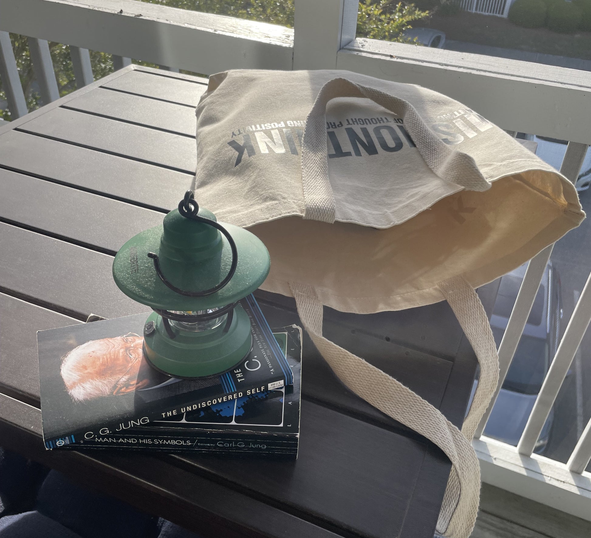 Mission Think Tote Bag shown outside. Reading "Mission Think Planting Seeds of Thought Provoking Positivity"